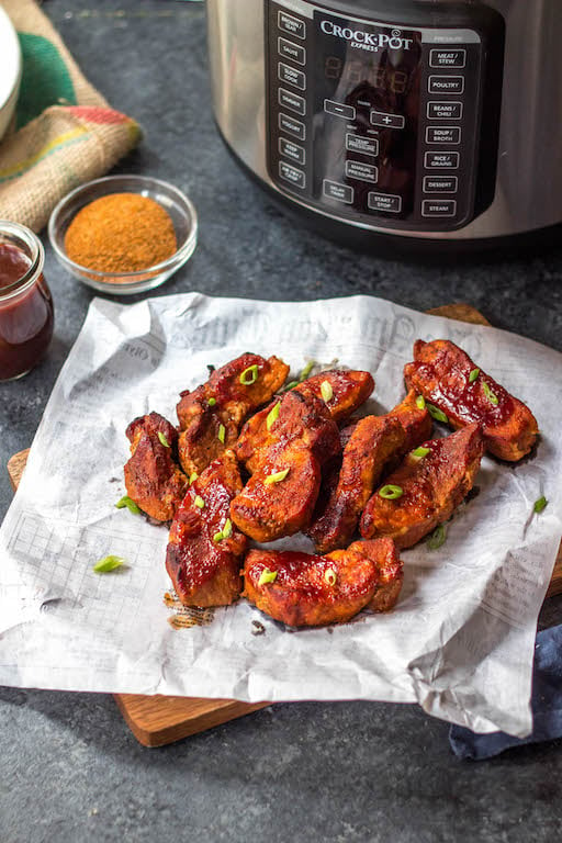 These paleo and Whole30 pressure cooker BBQ country style ribs are incredibly easy to make, only require a few simple ingredients and perfect for any holiday meal or weeknight dinner. They’re done in 30 minutes with very little hands-on time, and made with healthy, real food ingredients but still have the classic, comforting taste. #whole30pressurecooker #paleopressurecooker #whole30bbqribs #bbqcountrystyleribs