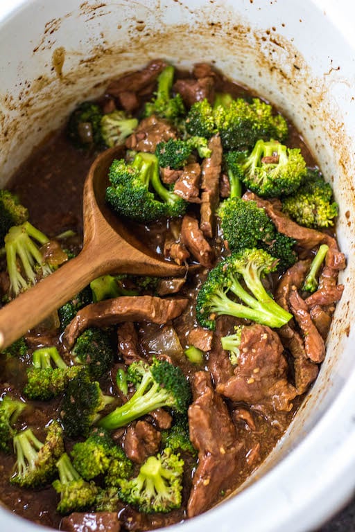 This easy Whole30 slow cooker recipe makes cooking beef and broccoli at home so simple. It comes together in the crock pot incredibly fast, and is a great meal prep recipe or weeknight meal because you just dump the ingredients, and come back later to a healthy, Paleo, keto and Whole30 broccoli beef waiting for you in the slow cooker! #whole30slowcooker #slowcookerbeefandbroccoli #ketoslowcooker #paleoslowcooker #beefandbroccoli