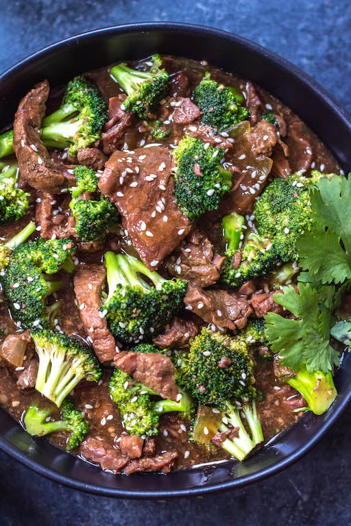 This easy Whole30 slow cooker recipe makes cooking beef and broccoli at home so simple. It comes together in the crock pot incredibly fast, and is a great meal prep recipe or weeknight meal because you just dump the ingredients, and come back later to a healthy, Paleo, keto and Whole30 broccoli beef waiting for you in the slow cooker! #whole30slowcooker #slowcookerbeefandbroccoli #ketoslowcooker #paleoslowcooker #beefandbroccoli