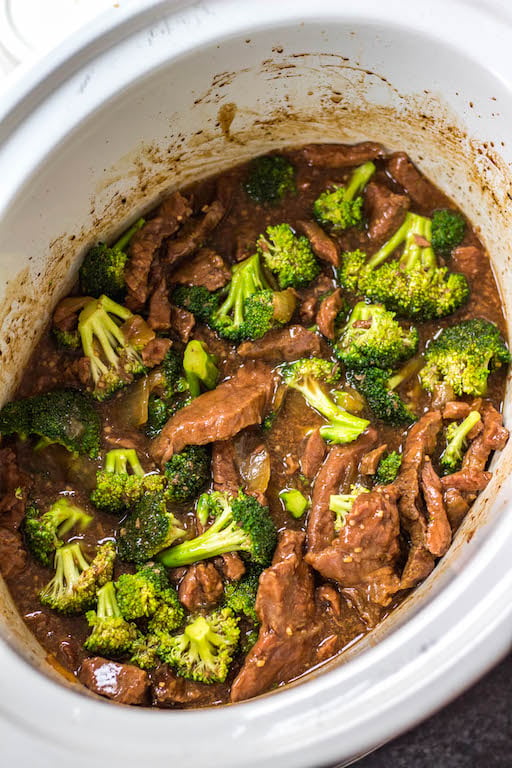 This easy Whole30 slow cooker recipe makes cooking beef and broccoli at home so simple. It comes together in the crock pot incredibly fast, and is a great meal prep recipe or weeknight meal because you just dump the ingredients, and come back later to a healthy, Paleo, keto and Whole30 broccoli beef waiting for you in the slow cooker! #whole30slowcooker #slowcookerbeefandbroccoli #ketoslowcooker #paleoslowcooker #beefandbroccoli