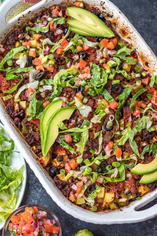 This Whole30 taco casserole is an awesome meal prep recipe or perfect for a paleo or gluten-free weeknight meal. Preparation is simple, just mix everything together, oven bake it, and pull out a delicious beef taco casserole for the family! It's a great way to use up ground beef, and it's healthy recipe option that's loaded with veggies #whole30tacocasserole #whole30casserole #whole30groundbeefrecipes #paleocasserole #paleotacocasserole #glutenfreecasserole