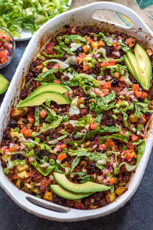 This Whole30 taco casserole is an awesome meal prep recipe or perfect for a paleo or gluten-free weeknight meal. Preparation is simple, just mix everything together, oven bake it, and pull out a delicious beef taco casserole for the family! It's a great way to use up ground beef, and it's healthy recipe option that's loaded with veggies #whole30tacocasserole #whole30casserole #whole30groundbeefrecipes #paleocasserole #paleotacocasserole #glutenfreecasserole