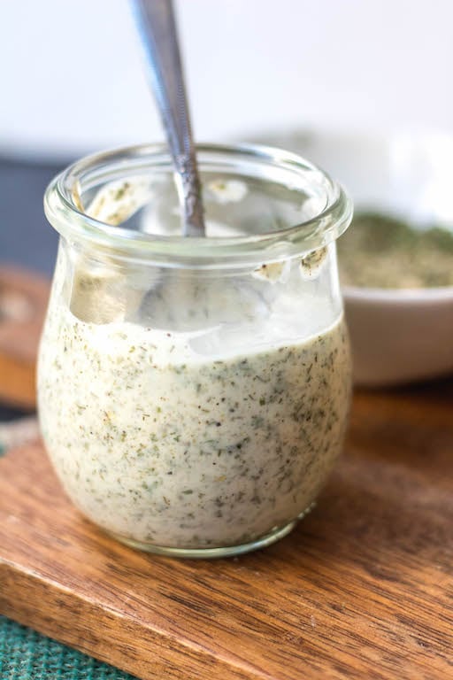 This Whole30 homemade ranch dressing is so easy to make at home. It's a paleo, keto, dairy-free and gluten-free DIY condiment that is perfect for dipping, drizzling or adding to a number of recipes. It takes under 5 minutes to whip together so it's a great addition to your meal prep to keep for the week ahead and is a healthy, budget-friendly alternative to store bought ranch. #whole30ranchdressing #whole30homemadedressing #ketoranch #paleoranch #dairyfreeranch