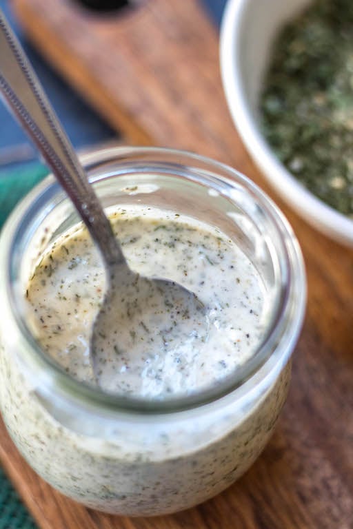 This Whole30 homemade ranch dressing is so easy to make at home. It's a paleo, keto, dairy-free and gluten-free DIY condiment that is perfect for dipping, drizzling or adding to a number of recipes. It takes under 5 minutes to whip together so it's a great addition to your meal prep to keep for the week ahead and is a healthy, budget-friendly alternative to store bought ranch. #whole30ranchdressing #whole30homemadedressing #ketoranch #paleoranch #dairyfreeranch