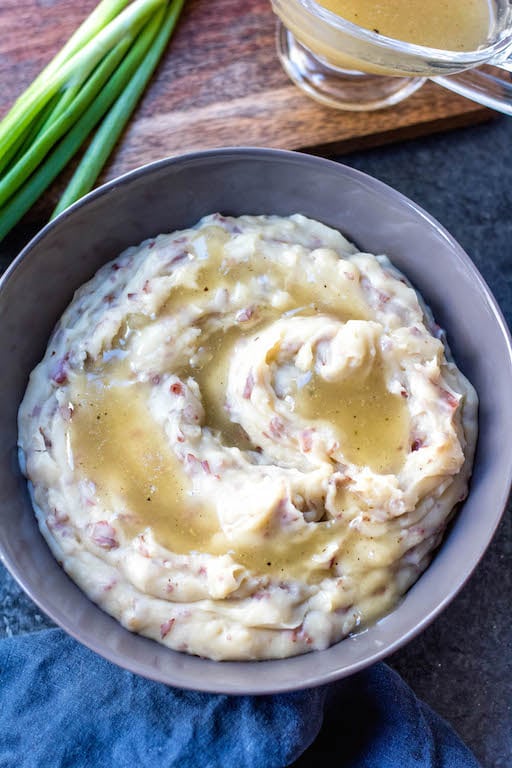 Whole30 creamy mashed potatoes in the slow cooker are a staple for a weeknight side dish, a meal prep recipe, or a holiday gathering. A perfect Paleo, dairy-free, and gluten-free side dish that’s full of comfort and incredibly easy. This family friendly favorite can be paired with just about anything and meal preps amazingly. #whole30sidedish #whole30mashedpotatoes #whole30slowcooker #paleoslowcooker #paleosidedish