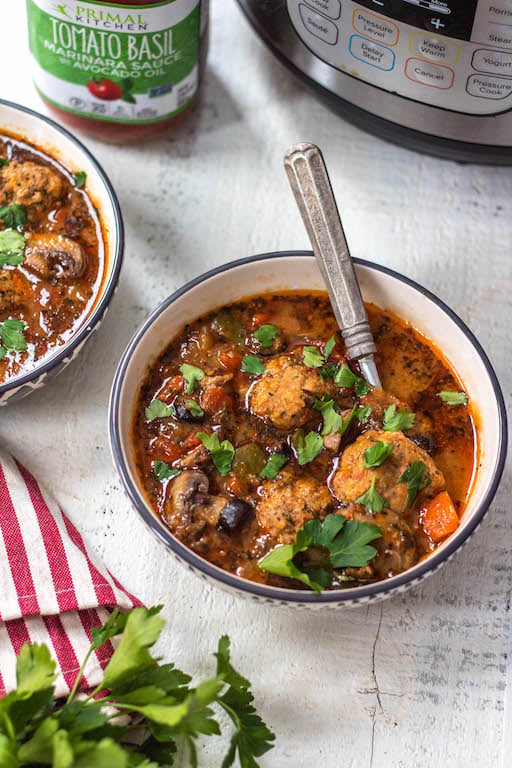 This Whole30 instant pot sausage pizza soup is so quick to make. Just roll the meatballs, add the vegetables and set the timer to 6 minutes! Perfect for meal prep or an easy weeknight dinner recipe that's healthy, paleo, gluten free and can be made keto! No fancy prep work here, just a few steps and this flavorful pizza soup is done! #whole30instantpot #whole30soup #whole30instantpotsoup #ketoinstantpot #paleoinstantpot