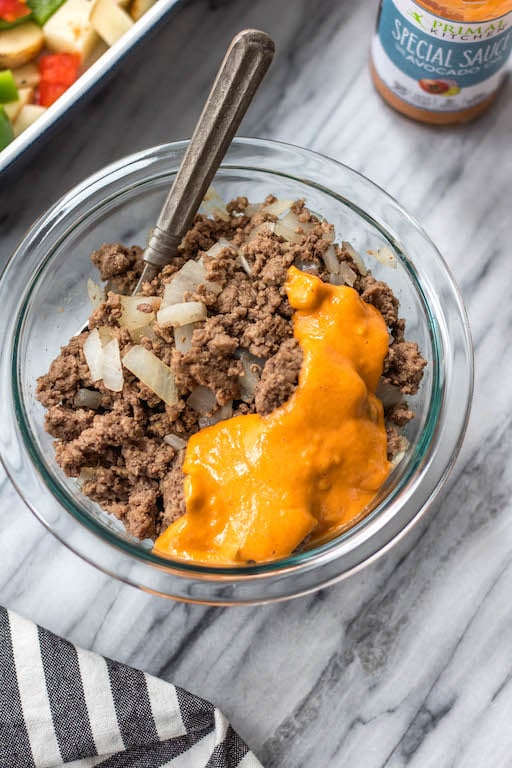 This is a delicious and easy Whole30 ground beef casserole recipe that is a healthy take on a big mac! The classic flavors you know and love, all baked together in a paleo, gluten free Big Mac casserole that's loaded with veggies. It's great for a family friendly weeknight meal, or for meal prep lunches for the week. #whole30casserole #whole30groundbeef #whole30dinnerrecipes #paleogroundbeef #glutenfree