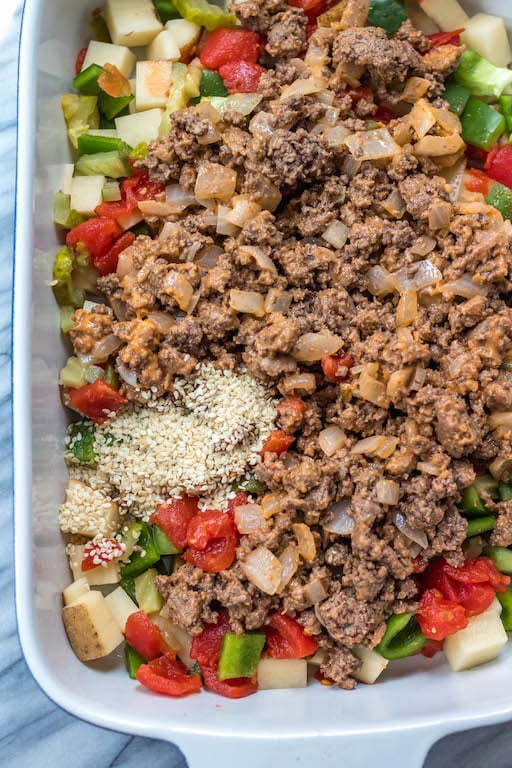 This is a delicious and easy Whole30 ground beef casserole recipe that is a healthy take on a big mac! The classic flavors you know and love, all baked together in a paleo, gluten free Big Mac casserole that's loaded with veggies. It's great for a family friendly weeknight meal, or for meal prep lunches for the week. #whole30casserole #whole30groundbeef #whole30dinnerrecipes #paleogroundbeef #glutenfree This is a delicious and easy Whole30 ground beef casserole recipe that is a healthy take on a big mac! The classic flavors you know and love, all baked together in a paleo, gluten free Big Mac casserole that's loaded with veggies. It's great for a family friendly weeknight meal, or for meal prep lunches for the week. #whole30casserole #whole30groundbeef #whole30dinnerrecipes #paleogroundbeef #glutenfree