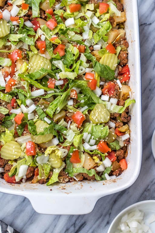 This is a delicious and easy Whole30 ground beef casserole recipe that is a healthy take on a big mac! The classic flavors you know and love, all baked together in a paleo, gluten free Big Mac casserole that's loaded with veggies. It's great for a family friendly weeknight meal, or for meal prep lunches for the week. #whole30casserole #whole30groundbeef #whole30dinnerrecipes #paleogroundbeef #glutenfree