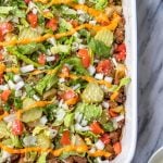 This is a delicious and easy Whole30 ground beef casserole recipe that is a healthy take on a big mac! The classic flavors you know and love, all baked together in a paleo, gluten free Big Mac casserole that's loaded with veggies. It's great for a family friendly weeknight meal, or for meal prep lunches for the week. #whole30casserole #whole30groundbeef #whole30dinnerrecipes #paleogroundbeef #glutenfree