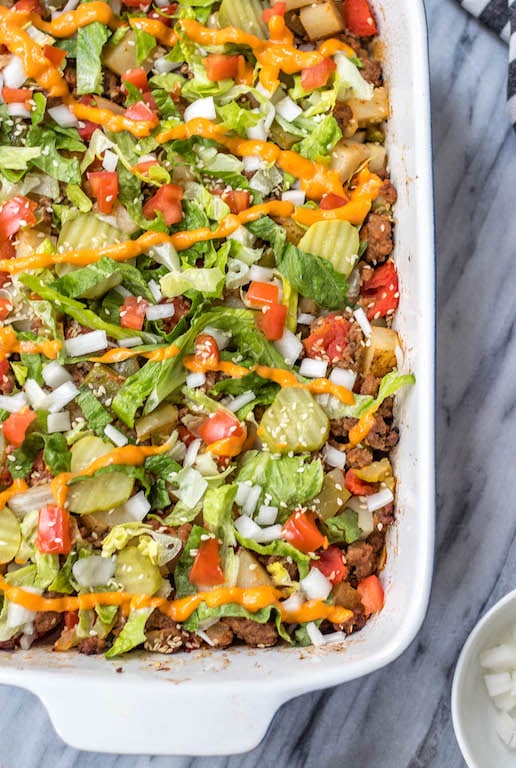 This is a delicious and easy Whole30 ground beef casserole recipe that is a healthy take on a big mac! The classic flavors you know and love, all baked together in a paleo, gluten free Big Mac casserole that's loaded with veggies. It's great for a family friendly weeknight meal, or for meal prep lunches for the week. #whole30casserole #whole30groundbeef #whole30dinnerrecipes #paleogroundbeef #glutenfree