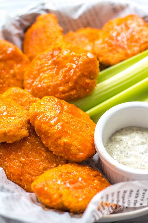 These buffalo chicken nuggets are the best easy and healthy weeknight dinner or meal prep idea. They're Whole30, Paleo, gluten-free, low carb and perfect for lunch, dinner, appetizers and even chopped up to make a buffalo chicken salad! It's a simple Whole30 ground chicken recipe that only takes a few ingredients and a few minutes in the oven! #whole30chickenrecipes #whole30groundchicken #whole30buffalo #paleochicken #glutenfree