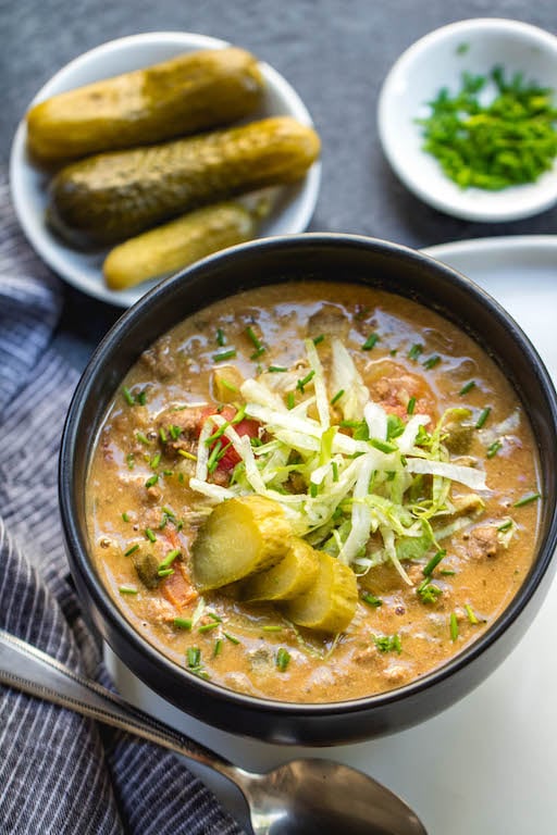 This Whole30 slow cooker cheeseburger soup might be dairy-free, but you won't notice with how creamy and full of flavor it is. It's an easy weeknight dinner to toss in the crock pot, or a simple paleo and gluten-free recipe to meal prep for the week because the leftovers are so delicious! Using ground beef and tons of vegetables, this Whole30 soup is sure to be a new favorite! #whole30slowcooker #whole30soup #whole30cheeseburgersoup #whole30groundbeef