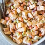 This healthy and easy buffalo chicken salad only takes a few simple ingredients, and is Whole30, paleo, low carb and gluten-free. It's got the perfect buffalo tang, while still being creamy and delicious! This recipe makes the perfect meal prep recipe, done in under 30 minutes, and that can be turned into many meals and enjoyed over greens, in wraps or straight out of the bowl. #whole30recipes #whole30chickenrecipes #ketochickenrecipes #chickensalad #buffalochicken #paleochickenrecipes #whole30mealprep