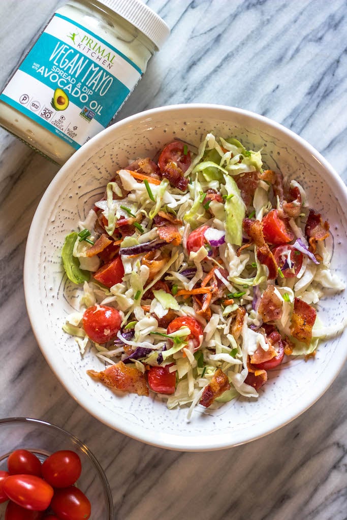 This easy BLT coleslaw is a light and flavorful side dish. It's Whole30, paleo, keto and gluten-free, all while not skimping on flavor. Creamy and healthy, the bacon and extra veggies added into this family favorite recipe are sure to be a hit! #whole30recipes #whole30sidedish #ketorecipes #lowcarb #coleslaw #ketobaconrecipes #paleorecipes