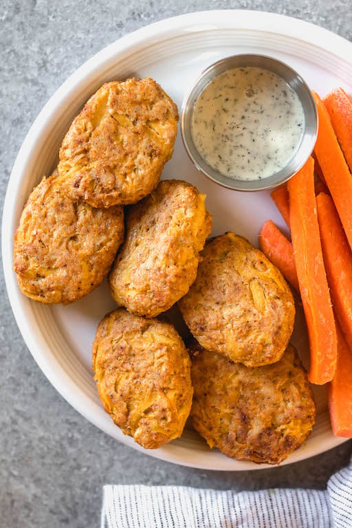 These easy butternut squash chicken nuggets are a healthy, Whole30 and gluten-free alternative to traditional nuggets. This recipe is a great way to sneak vegetables in, and are totally kid and family friendly, and paleo and low carb, too. With only a few ingredients, they're also quick to make for a weeknight meal or meal prep! #whole30recipes #whole30chicken #paleorecipes #paleochickenrecipes #lowcarb #keto #chickennuggets #glutenfreechicken #dinnerrecipes