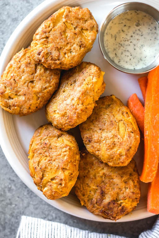 These easy butternut squash chicken nuggets are a healthy, Whole30 and gluten-free alternative to traditional nuggets. This recipe is a great way to sneak vegetables in, and are totally kid and family friendly, and paleo and low carb, too. With only a few ingredients, they're also quick to make for a weeknight meal or meal prep! #whole30recipes #whole30chicken #paleorecipes #paleochickenrecipes #lowcarb #keto #chickennuggets #glutenfreechicken #dinnerrecipes