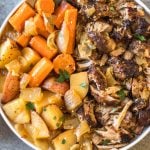 This easy and tender pork roast only takes a few ingredients and lets the slow cooker do the work for you! It's a healthy family friendly recipe for dinner or meal prep, and is Whole30, paleo and gluten-free. The delicious vegetables, plus the gravy, are all made in right in the crock pot with the pork shoulder, so this hearty and comforting dinner is completely ready when you are! #whole30recipes #whole30slowcooker #whole30pork #paleo #slowcookerpork #glutenfree #winterrecipes #porkrecipes