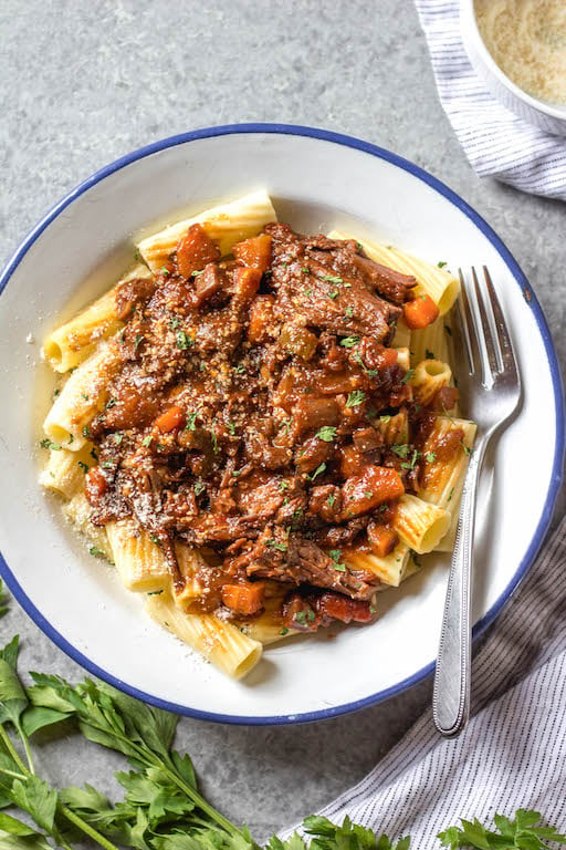 This slow cooker beef ragu is the perfect cozy and hearty weeknight meal or meal prep recipe that's not only Whole30, paleo, and gluten-free, but it is incredibly delicious. It's loaded with vegetables, easy to prepare and takes almost no hands-on cooking time thanks to the crock pot. It also freezes really well! This is sure to be a family favorite, and a go-to recipe when you need a quick meal to be ready for dinner. #whole30slowcooker #whole30recipes #paleoslowcooker #slowcookerbeefragu #whole30beef #bestwhole30recipes #whole30weeknight