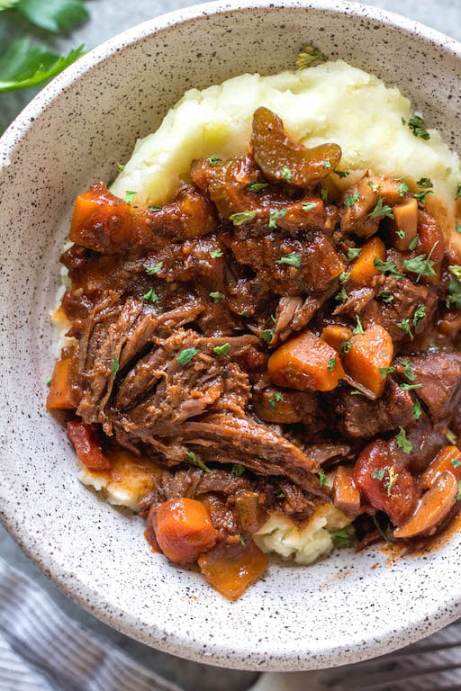 This slow cooker beef ragu is the perfect cozy and hearty weeknight meal or meal prep recipe that's not only Whole30, paleo, and gluten-free, but it is incredibly delicious. It's loaded with vegetables, easy to prepare and takes almost no hands-on cooking time thanks to the crock pot. It also freezes really well! This is sure to be a family favorite, and a go-to recipe when you need a quick meal to be ready for dinner. #whole30slowcooker #whole30recipes #paleoslowcooker #slowcookerbeefragu #whole30beef #bestwhole30recipes #whole30weeknight