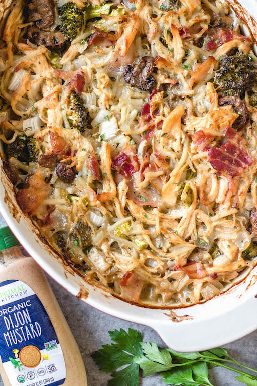 This creamy dijon chicken casserole is an easy and delicious Whole30, Paleo, gluten-free recipe that's great for a weeknight dinner or a simple and healthy meal prep recipe. There's lots of vegetables, bacon and a flavorful dairy-free cream sauce loaded into one casserole dish, and baked to perfection. #whole30recipes #whole30casseroles #paleocasseroles #glutenfreecasseroles #whole30chickenrecipes #easywhole30recipes #mealprep