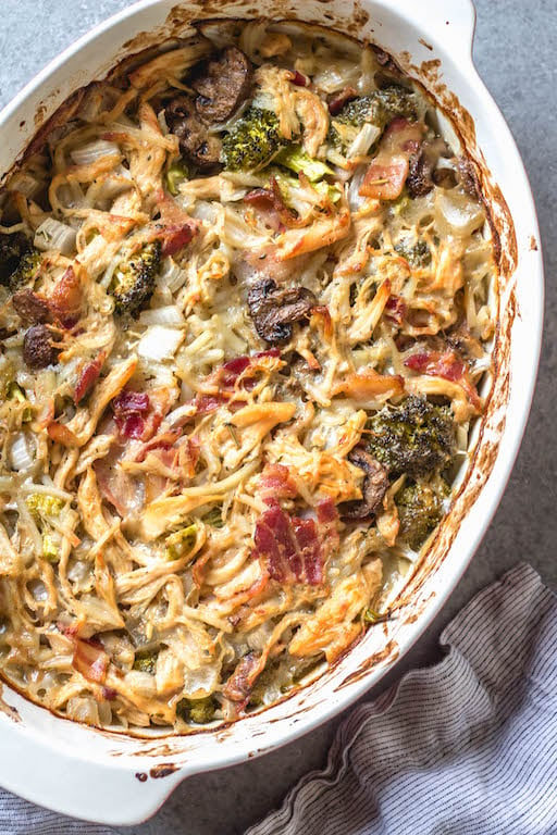 This creamy dijon chicken casserole is an easy and delicious Whole30, Paleo, gluten-free recipe that's great for a weeknight dinner or a simple and healthy meal prep recipe. There's lots of vegetables, bacon and a flavorful dairy-free cream sauce loaded into one casserole dish, and baked to perfection. #whole30recipes #whole30casseroles #paleocasseroles #glutenfreecasseroles #whole30chickenrecipes #easywhole30recipes #mealprep