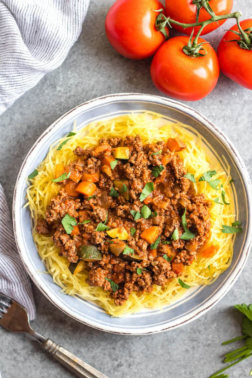 This Whole30 arrabbiata meat sauce with vegetables is made in the instant pot, so everything is cooked in one pot! Made with ground beef and with lots of vegetables snuck in, it's a hearty, cozy and healthy recipe that's great for meal prep. It's also gluten-free, Paleo and low carb/keto. This meat sauce is full of flavor and we love that it's freezer friendly, too. #whole30instantpot #whole30beefrecipes #whole30meatsauce #groundbeefrecipes #paleobeef