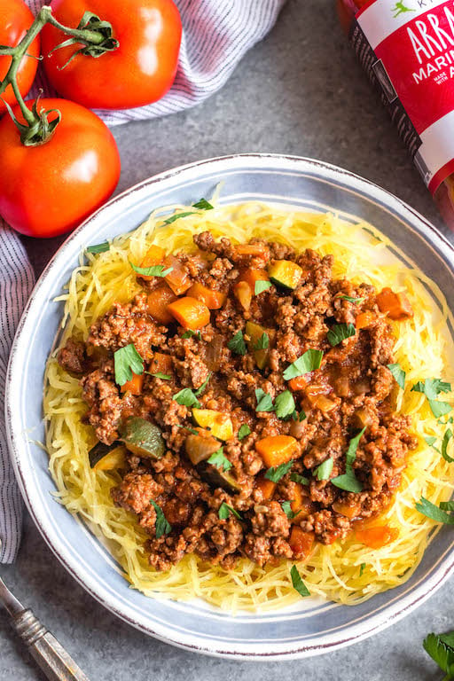 This Whole30 arrabbiata meat sauce with vegetables is made in the instant pot, so everything is cooked in one pot! Made with ground beef and with lots of vegetables snuck in, it's a hearty, cozy and healthy recipe that's great for meal prep. It's also gluten-free, Paleo and low carb/keto. This meat sauce is full of flavor and we love that it's freezer friendly, too. #whole30instantpot #whole30beefrecipes #whole30meatsauce #groundbeefrecipes #paleobeef