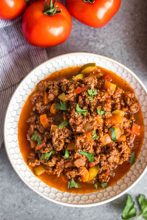 This Whole30 arrabbiata meat sauce with vegetables is made in the instant pot, so everything is cooked in one pot! Made with ground beef and with lots of vegetables snuck in, it's a hearty, cozy and healthy recipe that's great for meal prep. It's also gluten-free, Paleo and low carb/keto. This meat sauce is full of flavor and we love that it's freezer friendly, too. #whole30instantpot #whole30beefrecipes #whole30meatsauce #groundbeefrecipes #paleobeef