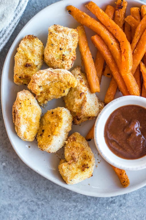 These Whole30 copycat Chick-fil-A chicken nuggets are such a great easy weeknight meal or family friendly go-to recipe for lunch or dinner. They're paleo, low carb, and made with simple ingredients, making them a healthier option than the drive through! These nuggets use pickle brined chicken pieces, then coated in a grain-and gluten-free mixture and cooked in the air fryer to perfection. #whole30airfryer #whole30chickennuggets #chickfilanuggets #glutenfreeairfryer #paleoairfryer #whole30chickenrecipes