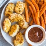 These Whole30 copycat Chick-fil-A chicken nuggets are such a great easy weeknight meal or family friendly go-to recipe for lunch or dinner. They're paleo, low carb, and made with simple ingredients, making them a healthier option than the drive through! These nuggets use pickle brined chicken pieces, then coated in a grain-and gluten-free mixture and cooked in the air fryer to perfection. #whole30airfryer #whole30chickennuggets #chickfilanuggets #glutenfreeairfryer #paleoairfryer #whole30chickenrecipes