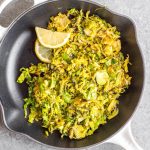 This Whole30 shredded brussels sprouts recipe is the perfect side dish for any breakfast or dinner. They're crispy, sauté really quickly, and only need 3 ingredients. The lemon and garlic flavor pairs well with everything, and keeps the brussels sprouts bright and fresh tasting! These are also low carb/keto, Paleo, gluten-free and just a great way to enjoy your green vegetables! #whole30vegetables #whole30sides #whole30brusselssprouts #ketovegetables #whole30recipes #paleovegetables