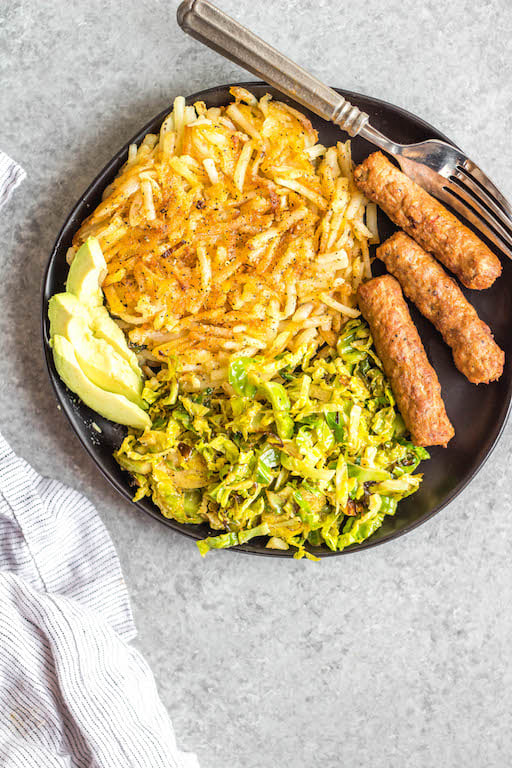This Whole30 shredded brussels sprouts recipe is the perfect side dish for any breakfast or dinner. They're crispy, sauté really quickly, and only need 3 ingredients. The lemon and garlic flavor pairs well with everything, and keeps the brussels sprouts bright and fresh tasting! These are also low carb/keto, Paleo, gluten-free and just a great way to enjoy your green vegetables! #whole30vegetables #whole30sides #whole30brusselssprouts #ketovegetables #whole30recipes #paleovegetables