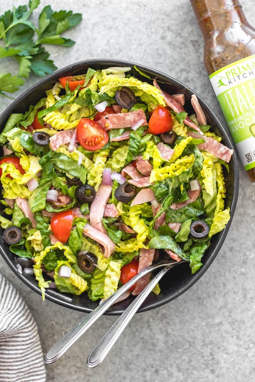 This easy Italian chopped salad is the perfect meal for lunch or dinner that requires no cooking, but is filling, healthy and loaded with vegetables! It's great for a light and fresh lunch, and still delicious enough to serve to guests. It's Whole30, paleo, keto/low carb, and gluten-free, and is a great way to clean all of those vegetables and deli meat out of the fridge! #whole30salad #whole30choppedsalad #ketosalad #lowcarbsalad #italiansalad #whole30recipes