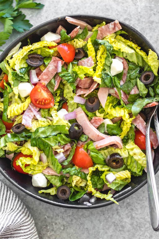 This easy Italian chopped salad is the perfect meal for lunch or dinner that requires no cooking, but is filling, healthy and loaded with vegetables! It's great for a light and fresh lunch, and still delicious enough to serve to guests. It's Whole30, paleo, keto/low carb, and gluten-free, and is a great way to clean all of those vegetables and deli meat out of the fridge! #whole30salad #whole30choppedsalad #ketosalad #lowcarbsalad #italiansalad #whole30recipes This easy Italian chopped salad is the perfect meal for lunch or dinner that requires no cooking, but is filling, healthy and loaded with vegetables! It's great for a light and fresh lunch, and still delicious enough to serve to guests. It's Whole30, paleo, keto/low carb, and gluten-free, and is a great way to clean all of those vegetables and deli meat out of the fridge! #whole30salad #whole30choppedsalad #ketosalad #lowcarbsalad #italiansalad #whole30recipes