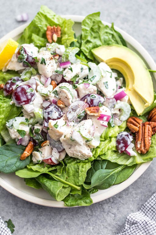 This classic chicken salad is an easy meal prep recipe that's Whole30, Paleo, gluten-free and low carb! It's made with grapes, celery and mayo and only a few other simple ingredients, making it a quick option to throw together, and is a great way to use leftover chicken. It's perfect for storing in the fridge and enjoying over greens for lunches, for a gathering, or a family meal that takes under 30 minutes to make! #whole30recipes #whole30chickensalad #classicchickensalad #ketochickensalad #lowcarbchicken #whole30chickenrecipes #chickensaladwithgrapes