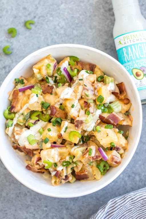 This Whole30 buffalo ranch potato salad recipe is a healthy, easy side dish or vegetable recipe that's a perfect addition to any meal or gathering. It's full of flavor from the sauces, bacon, golden potatoes, onion and celery, while being dairy-free, gluten-free and Paleo. It's a family friendly recipe that is also great for meal prep to pair with a protein and eat all week long. #whole30potato #buffalo #ranchrecipes #whole30potatosalad #bacon #whole30vegetablerecipes