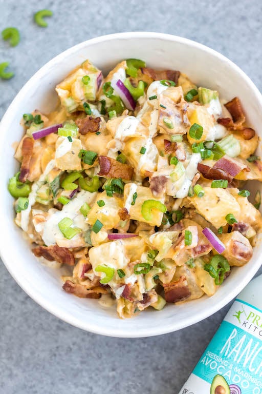 This Whole30 buffalo ranch potato salad recipe is a healthy, easy side dish or vegetable recipe that's a perfect addition to any meal or gathering. It's full of flavor from the sauces, bacon, golden potatoes, onion and celery, while being dairy-free, gluten-free and Paleo. It's a family friendly recipe that is also great for meal prep to pair with a protein and eat all week long. #whole30potato #buffalo #ranchrecipes #whole30potatosalad #bacon #whole30vegetablerecipes