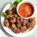 These easy ground pork meatballs are made in the air fryer, take under 20 minutes, and only need a few simple ingredients. No need to turn your oven on to get perfect, juicy and healthy meatballs! These air fryer meatballs are Whole30, paleo, keto (low carb), and gluten-free. They're ideal for a quick weeknight dinner, and work great for a meal prep recipe because they reheat so well, too! #airfryerrecipes #airfryermeatballs #whole30meatballs #porkrecipes #whole30 #keto