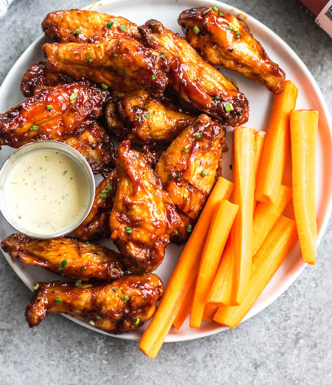 These smoked BBQ wings are easy, don't take very long, and totally delicious! They also only require a few ingredients, and are Whole30, Paleo, gluten-free and keto. Unlike meats when cooked on a smoker, wings are straightforward and not very fussy. These wings are perfectly juicy, have a great smoky flavor and great for any gathering! #whole30chickenwings #smokedchicken #paleochicken #ketochicken #ketosmokerrecipes