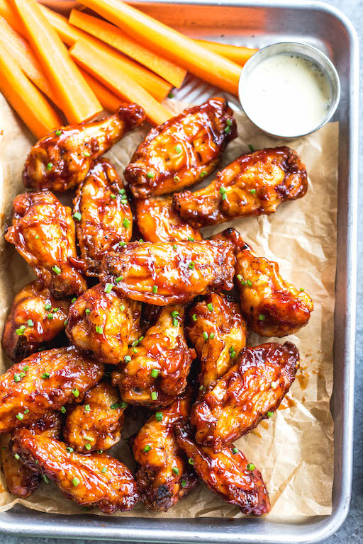 These smoked BBQ wings are easy, don't take very long, and totally delicious! They also only require a few ingredients, and are Whole30, Paleo, gluten-free and keto. Unlike meats when cooked on a smoker, wings are straightforward and not very fussy. These wings are perfectly juicy, have a great smoky flavor and great for any gathering! #whole30chickenwings #smokedchicken #paleochicken #ketochicken #ketosmokerrecipes