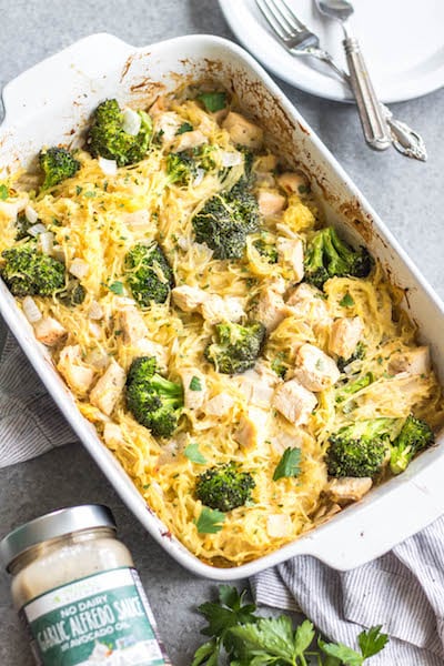 This simple chicken alfredo spaghetti squash casserole is filled with broccoli and onions, and perfect for meal prep or a weeknight chicken dinner recipe. It's Whole30, paleo, keto/low carb, gluten free and dairy free, all while being a delicious, hearty and vegetable-filled meal! It comes together very easily, and reheats well. #whole30chicken #whole30recipes #whole30casserole #lowcarbchicken #paleochicken #chickencasserole #spaghettisquash