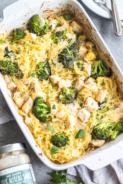 This simple chicken alfredo spaghetti squash casserole is filled with broccoli and onions, and perfect for meal prep or a weeknight chicken dinner recipe. It's Whole30, paleo, keto/low carb, gluten free and dairy free, all while being a delicious, hearty and vegetable-filled meal! It comes together very easily, and reheats well. #whole30chicken #whole30recipes #whole30casserole #lowcarbchicken #paleochicken #chickencasserole #spaghettisquash