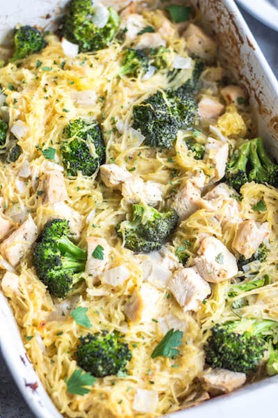 This simple chicken alfredo spaghetti squash casserole is filled with broccoli and onions, and perfect for meal prep or a weeknight chicken dinner recipe. It's Whole30, paleo, keto/low carb, gluten free and dairy free, all while being a delicious, hearty and vegetable-filled meal! It comes together very easily, and reheats well. #whole30chicken #whole30recipes #whole30casserole #lowcarbchicken #paleochicken #chickencasserole #spaghettisquash