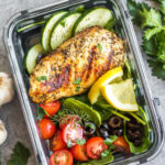 These healthy grilled Greek chicken bowls are perfect for weekday lunches or an easy dinner! Made with only a few simple ingredients, boneless chicken breasts, and fresh vegetables like tomatoes, cucumbers and green pepper, meal prep couldn't be more simple! This grilled chicken is also Whole30, paleo, low carb (keto), and gluten-free. #grilledchicken #whole30greekchicken #paleochicken #ketogrilling #mealprep