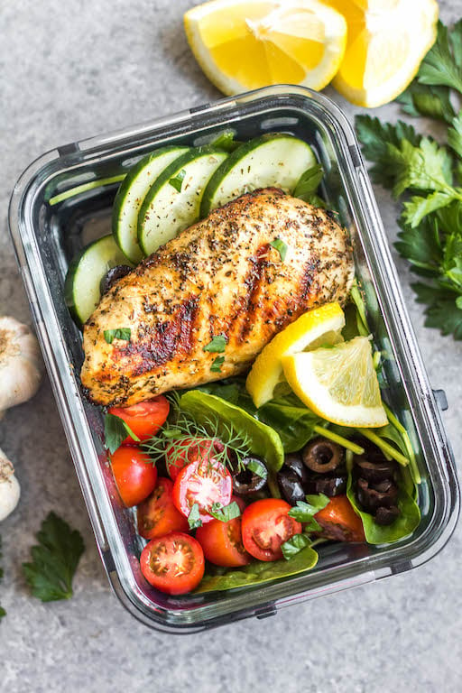 These healthy grilled Greek chicken bowls are perfect for weekday lunches or an easy dinner! Made with only a few simple ingredients, boneless chicken breasts, and fresh vegetables like tomatoes, cucumbers and green pepper, meal prep couldn't be more simple! This grilled chicken is also Whole30, paleo, low carb (keto), and gluten-free. #grilledchicken #whole30greekchicken #paleochicken #ketogrilling #mealprep