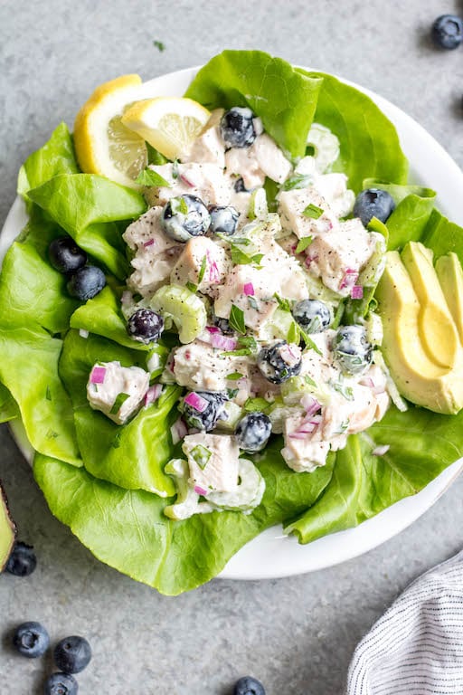 This easy blueberry chicken salad is an easy, healthy salad recipe that's perfect for meal prep lunches or as a way to use leftover chicken. It's Whole30, Paleo, dairy-free and only uses a few simple ingredients. It's great as leftovers, or simple to throw together for gatherings. Made with celery, mayo, pecans and red onion, this Whole30 salad comes together in under 30 minutes! #whole30chickenrecipes #whole30chickensalad #blueberryrecipes #lowcarb #paleochicken