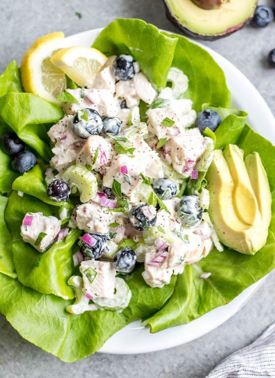 This easy blueberry chicken salad is an easy, healthy salad recipe that's perfect for meal prep lunches or as a way to use leftover chicken. It's Whole30, Paleo, dairy-free and only uses a few simple ingredients. It's great as leftovers, or simple to throw together for gatherings. Made with celery, mayo, pecans and red onion, this Whole30 salad comes together in under 30 minutes! #whole30chickenrecipes #whole30chickensalad #blueberryrecipes #lowcarb #paleochicken