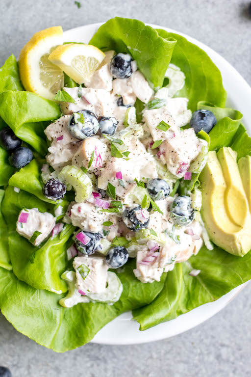 This easy blueberry chicken salad is an easy, healthy salad recipe that's perfect for meal prep lunches or as a way to use leftover chicken. It's Whole30, Paleo, dairy-free and only uses a few simple ingredients. It's great as leftovers, or simple to throw together for gatherings. Made with celery, mayo, pecans and red onion, this Whole30 salad comes together in under 30 minutes! #whole30chickenrecipes #whole30chickensalad #blueberryrecipes #lowcarb #paleochicken