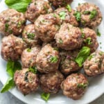 These easy greek meatballs are are a quick weeknight dinner or meal prep recipe that's Whole30, low carb, paleo and gluten-free. They freeze well, are simple to prepare and bake in the oven in under 30 minutes. Using ground beef, ground pork and only a few spices, these healthy meatballs are full of flavor and will be a family favorite! #whole30recipes #meatballrecipes #greekmeatballs #keto #paleo